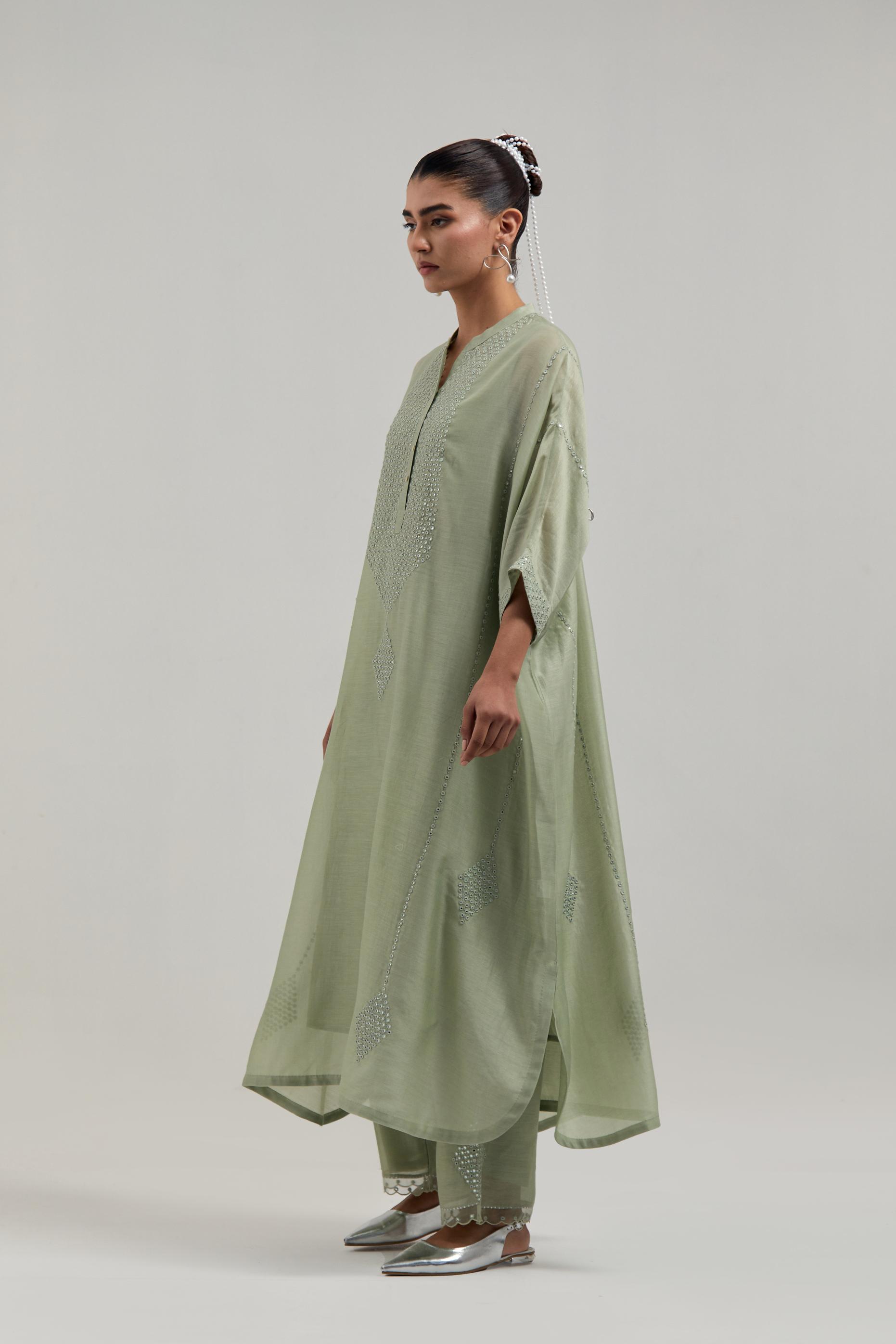 Green silk Chanderi long kaftan with hand-embroidered mirror and sequins at the neck and diamond motifs along the sides, paired with Green silk Chanderi straight pants with narrow organza scalloped hem and hand-embroidered diamond motifs with delicate.