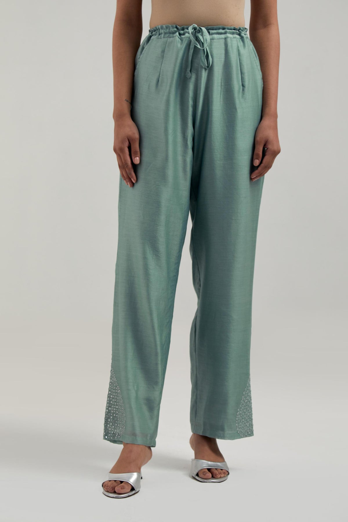 Blue Silk Chanderi pants with hand embroidered leaf motifs with delicate mirror & sequins work at hem.