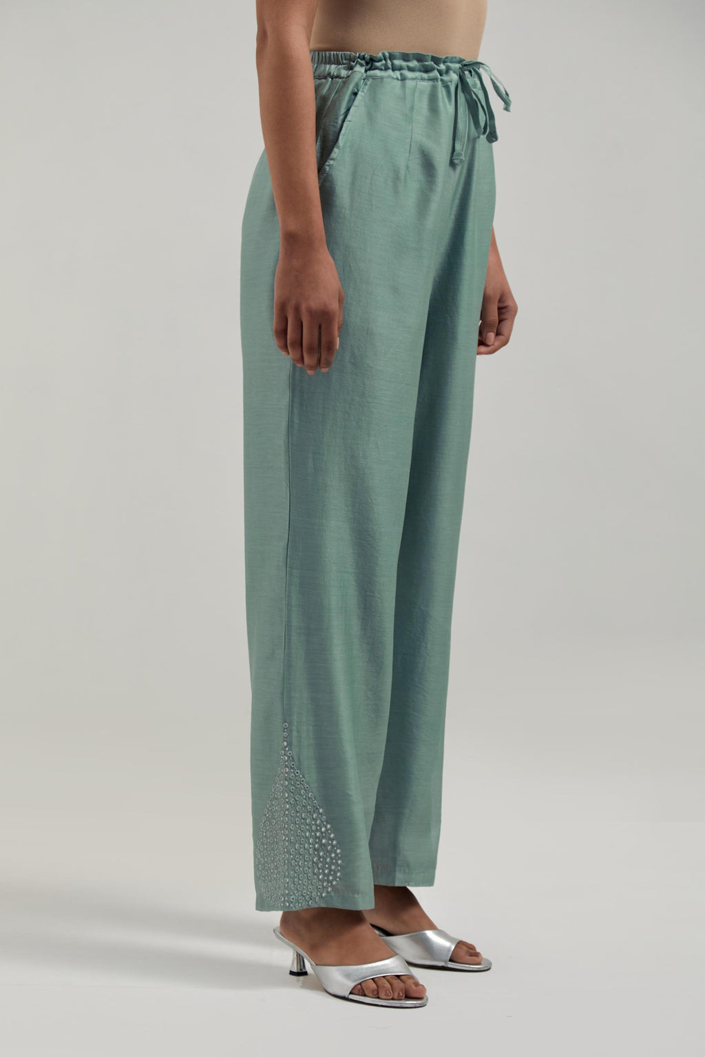 Blue Silk Chanderi pants with hand embroidered leaf motifs with delicate mirror & sequins work at hem.