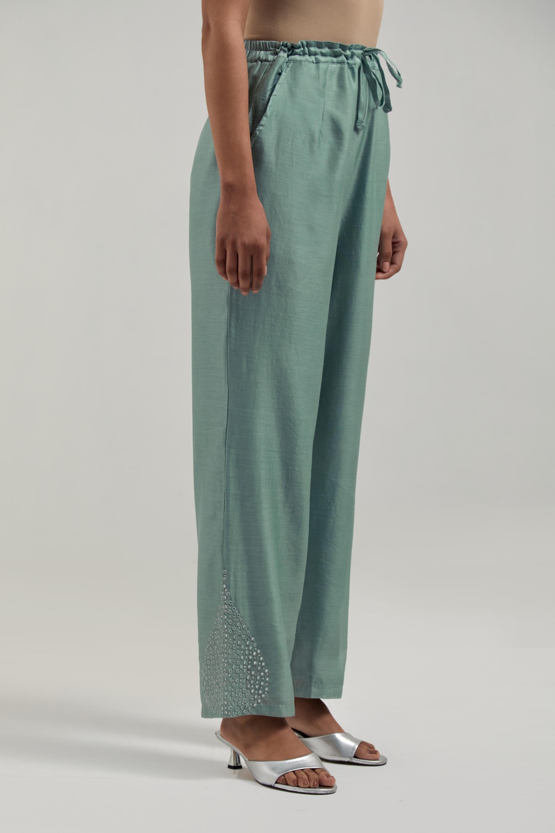 Blue Silk Chanderi pants with hand embroidered leaf motifs with delicate mirror & sequins work at hem.