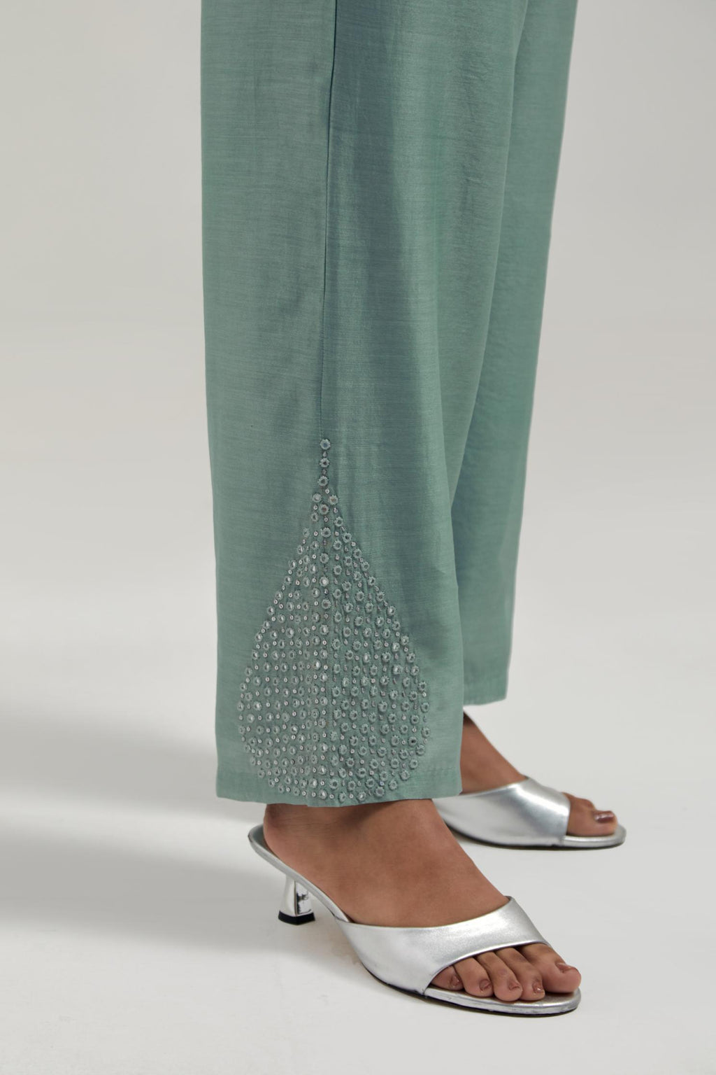 Blue Silk Chanderi pants with hand embroidered leaf motifs with delicate mirror & sequins work at hem.