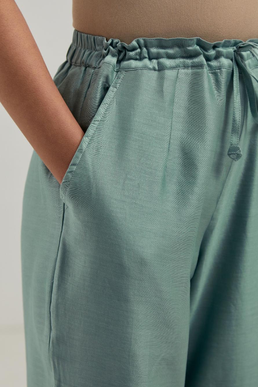 Blue Silk Chanderi pants with hand embroidered leaf motifs with delicate mirror & sequins work at hem.