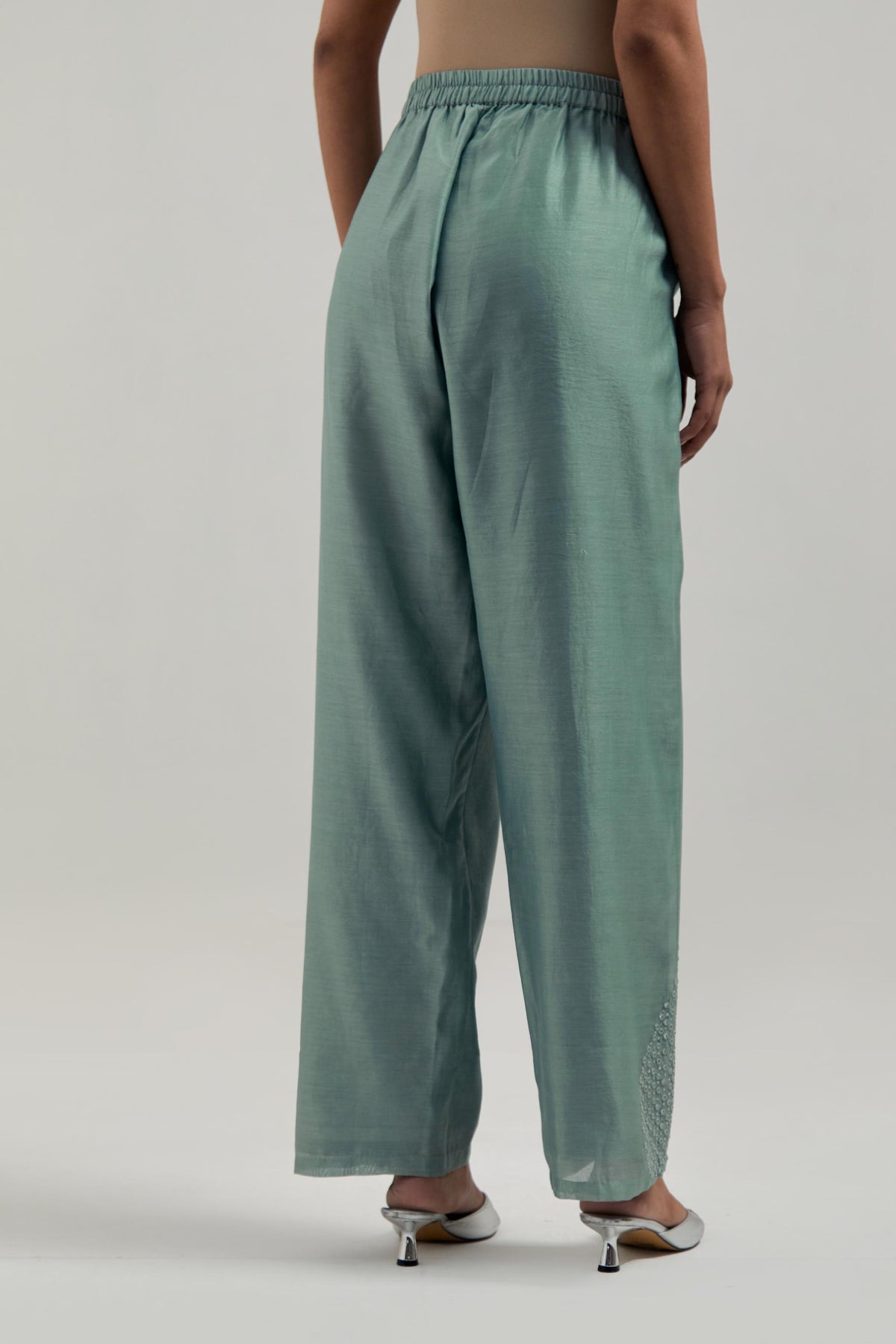 Blue Silk Chanderi pants with hand embroidered leaf motifs with delicate mirror & sequins work at hem.