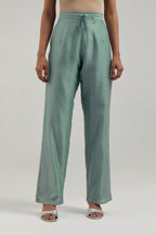 Blue silk Chanderi pants with hand-embroidered paisley motifs with delicate mirror and sequins work at the hem.