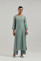 Blue silk Chanderi straight kurta set with all-over hand embroidered mirror and silver sequins.