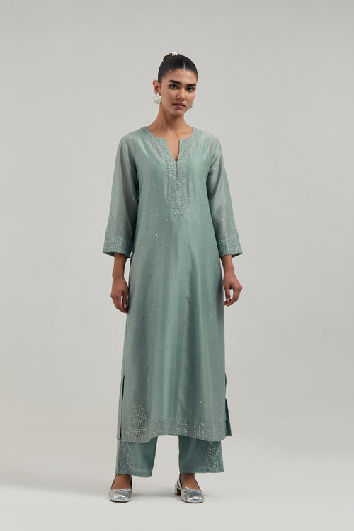 Blue silk Chanderi straight kurta set with all-over hand embroidered mirror and silver sequins.