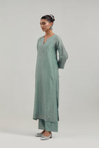 Blue silk Chanderi straight kurta set with all-over hand embroidered mirror and silver sequins.