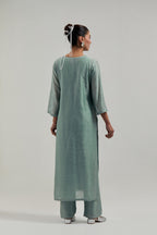 Blue silk Chanderi straight kurta set with all-over hand embroidered mirror and silver sequins.