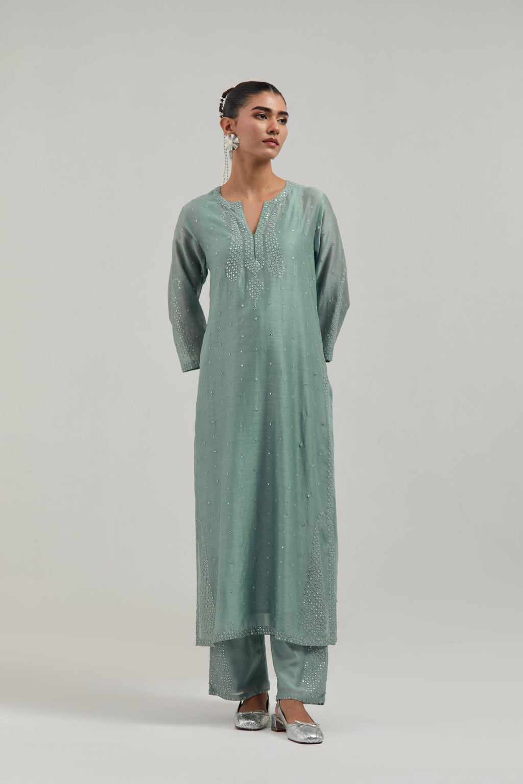 Blue silk Chanderi straight kurta set with hand-embroidered paisley motifs with delicate mirror and sequins work at neck, hem, and sleeves, with narrow borders along the edges.