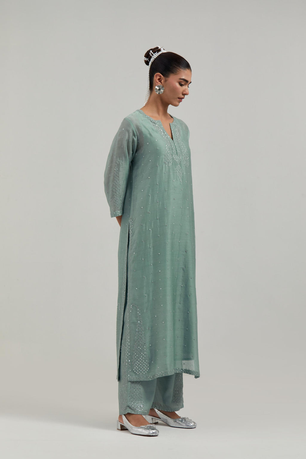 Blue silk Chanderi straight kurta set with hand-embroidered paisley motifs with delicate mirror and sequins work at neck, hem, and sleeves, with narrow borders along the edges.