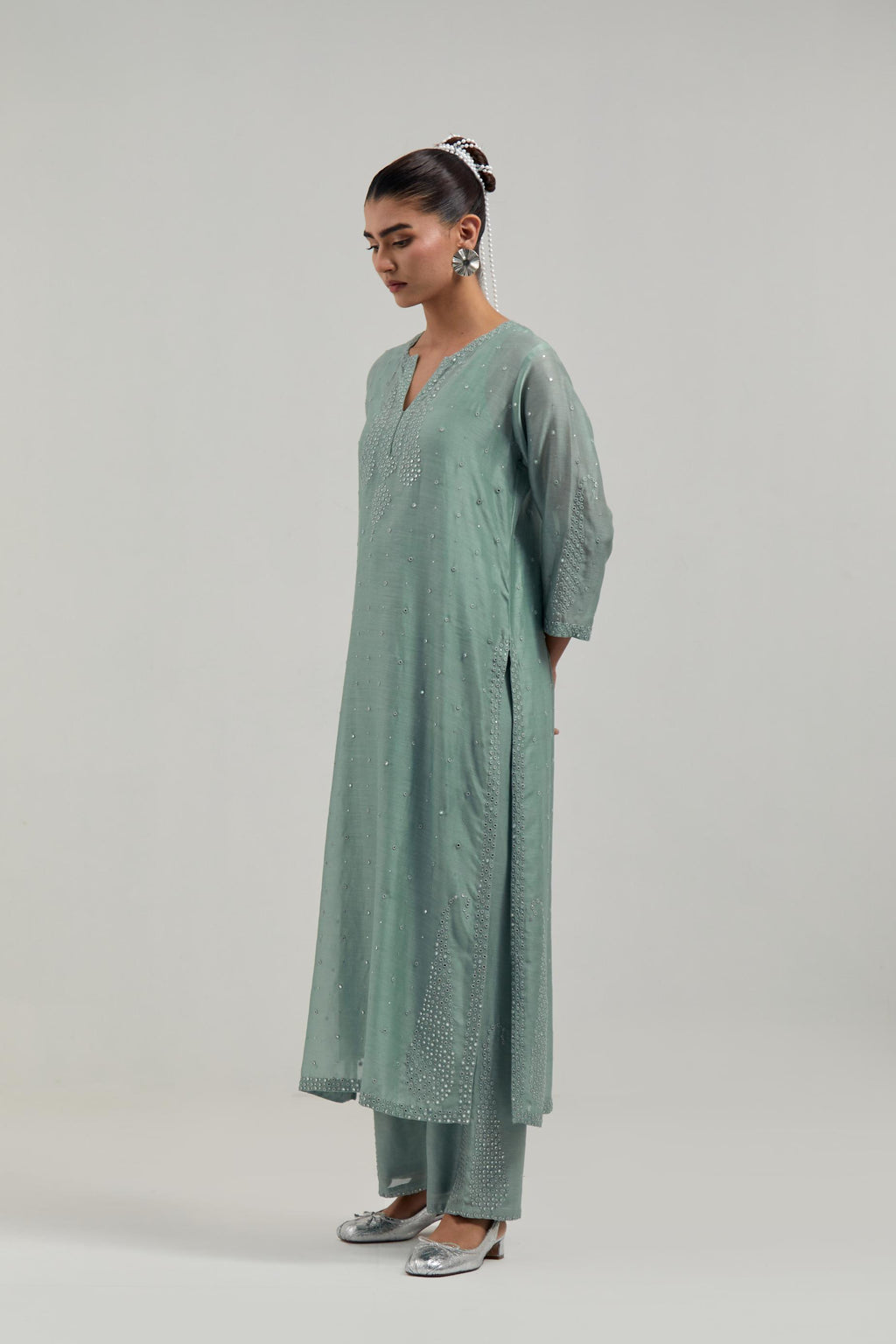 Blue silk Chanderi straight kurta set with hand-embroidered paisley motifs with delicate mirror and sequins work at neck, hem, and sleeves, with narrow borders along the edges.