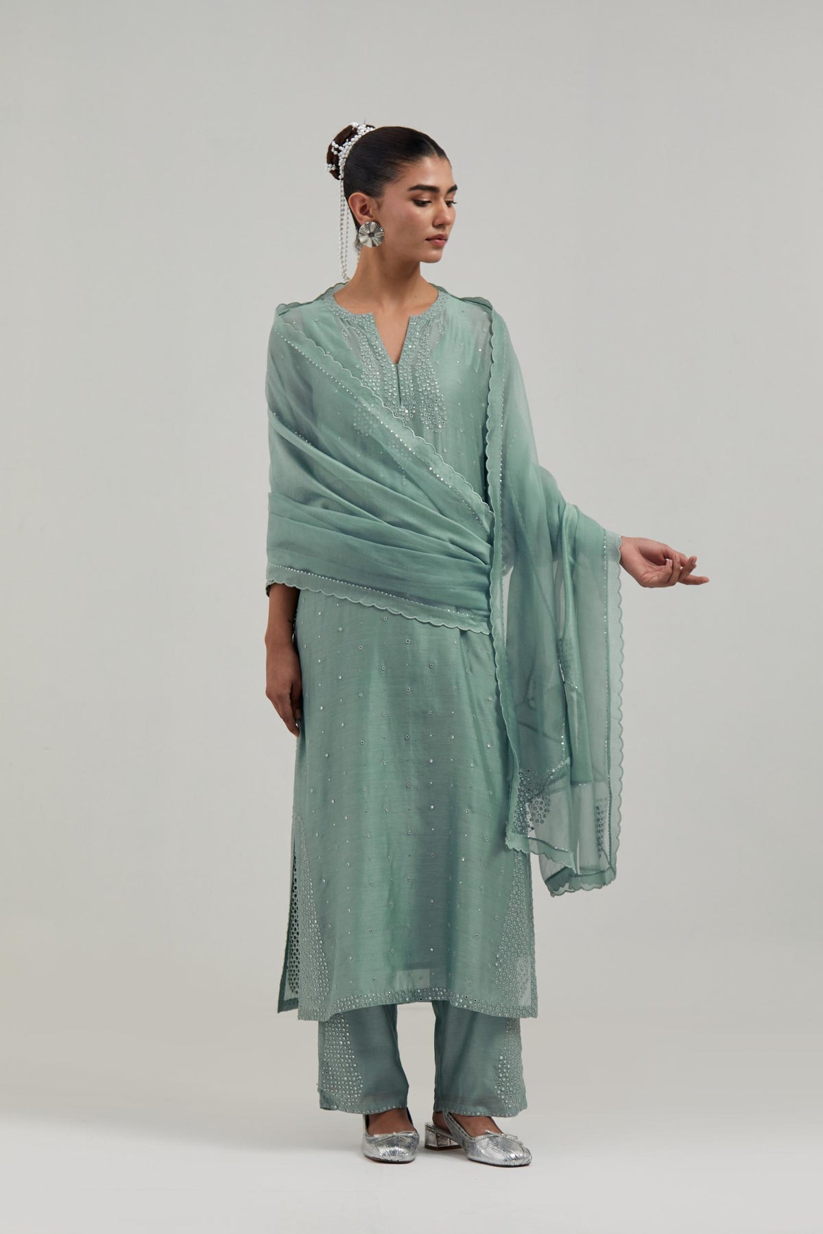 Blue silk Chanderi straight kurta set with hand-embroidered paisley motifs with delicate mirror and sequins work at neck, hem, and sleeves, with narrow borders along the edges.