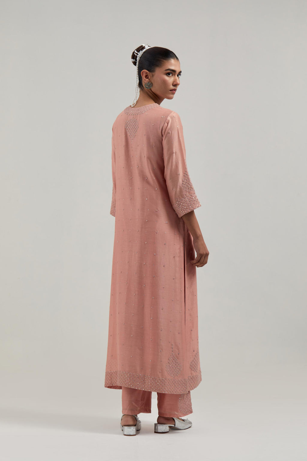 Peach silk Chanderi straight kurta set with all-over hand embroidered mirror and silver sequins.