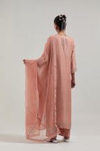 Peach silk Chanderi straight kurta set with all-over hand embroidered mirror and silver sequins.