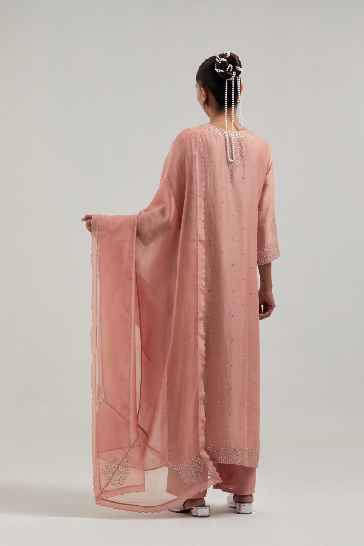 Peach silk Chanderi straight kurta set with all-over hand embroidered mirror and silver sequins.