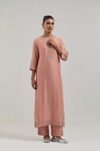 Peach silk Chanderi straight kurta set with all-over hand embroidered mirror and silver sequins.