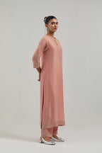 Peach silk Chanderi straight kurta set with all-over hand embroidered mirror and silver sequins.