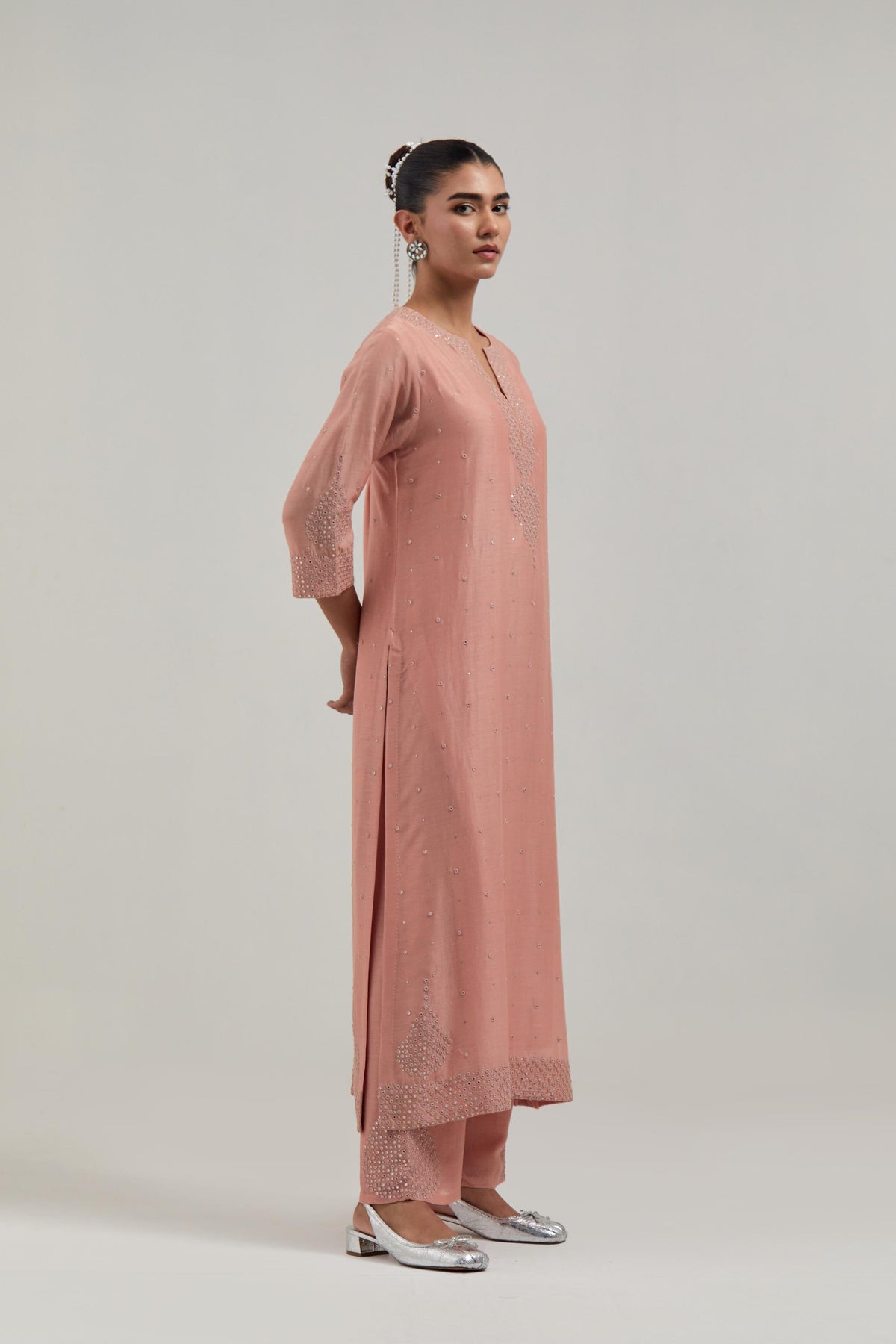 Peach silk Chanderi straight kurta set with all-over hand embroidered mirror and silver sequins.