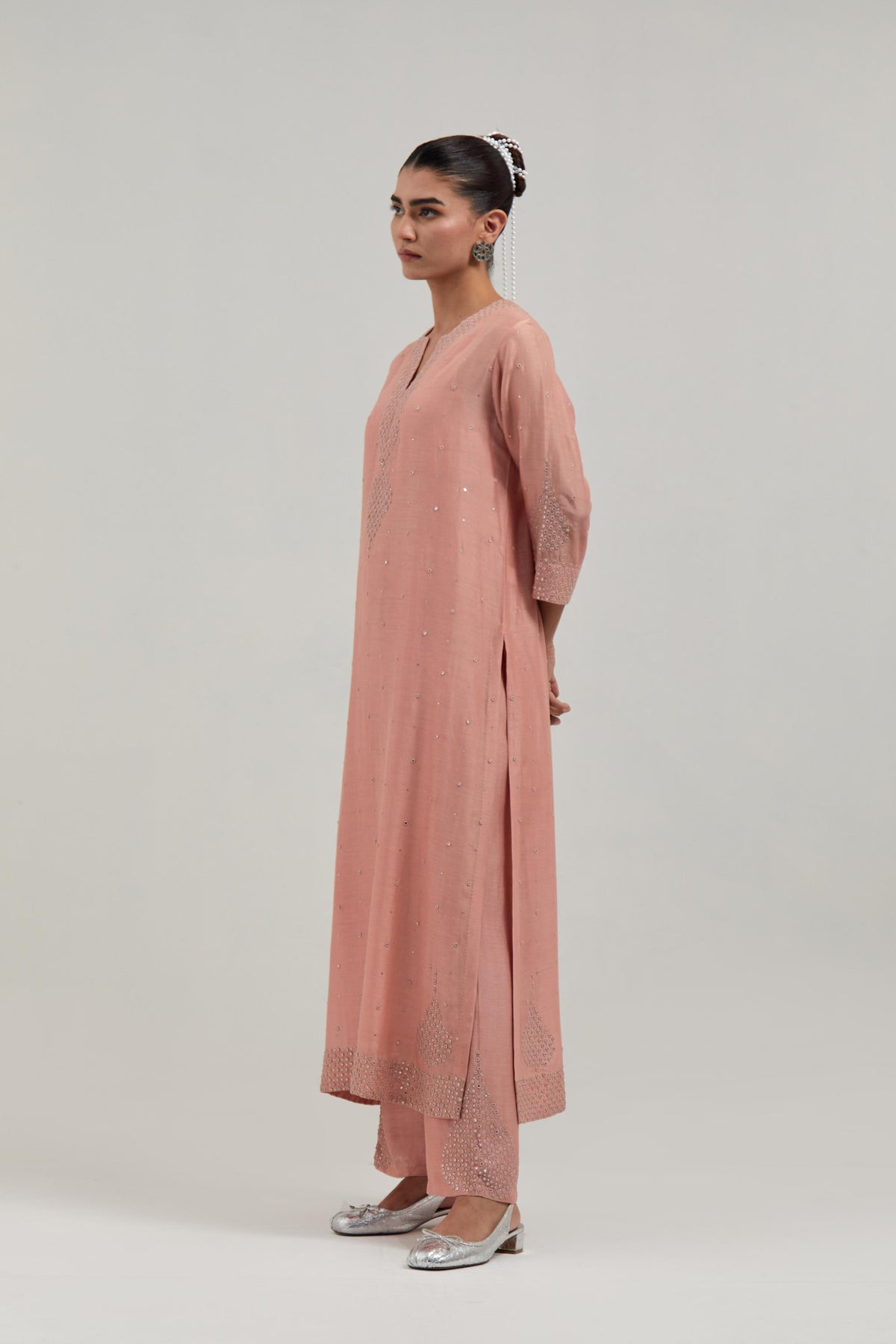 Peach silk Chanderi straight kurta set with all-over hand embroidered mirror and silver sequins.