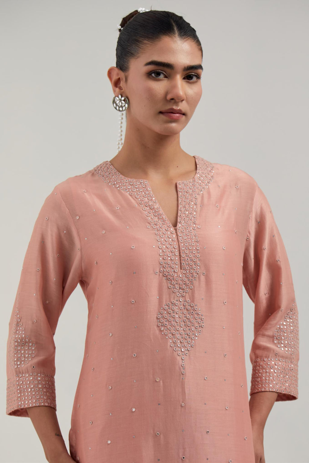 Peach silk Chanderi straight kurta set with all-over hand embroidered mirror and silver sequins.