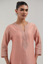 Peach silk Chanderi straight kurta set with all-over hand embroidered mirror and silver sequins.