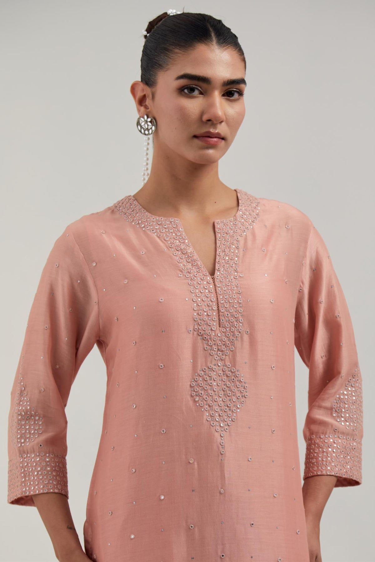 Peach silk Chanderi straight kurta set with all-over hand embroidered mirror and silver sequins.
