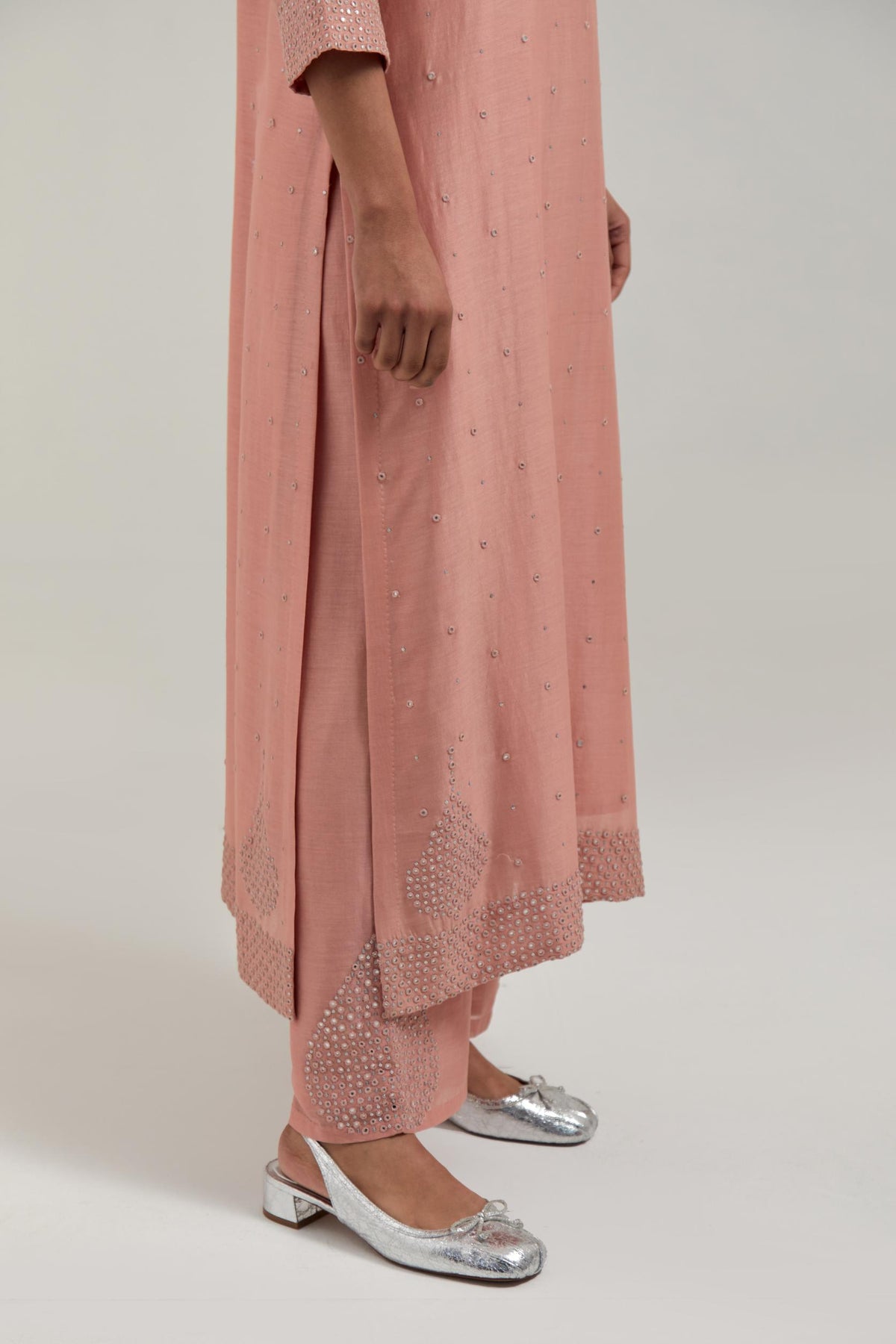 Peach silk Chanderi straight kurta set with all-over hand embroidered mirror and silver sequins.