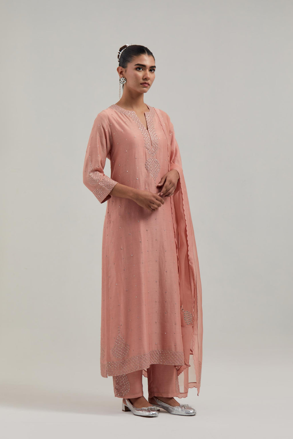 Peach silk Chanderi straight kurta set with all-over hand embroidered mirror and silver sequins.