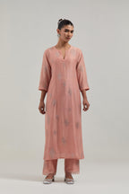 Peach Silk Chanderi straight kurta set with hand embroidered diamond motifs with delicate mirror and sequins work all-over the kurta.