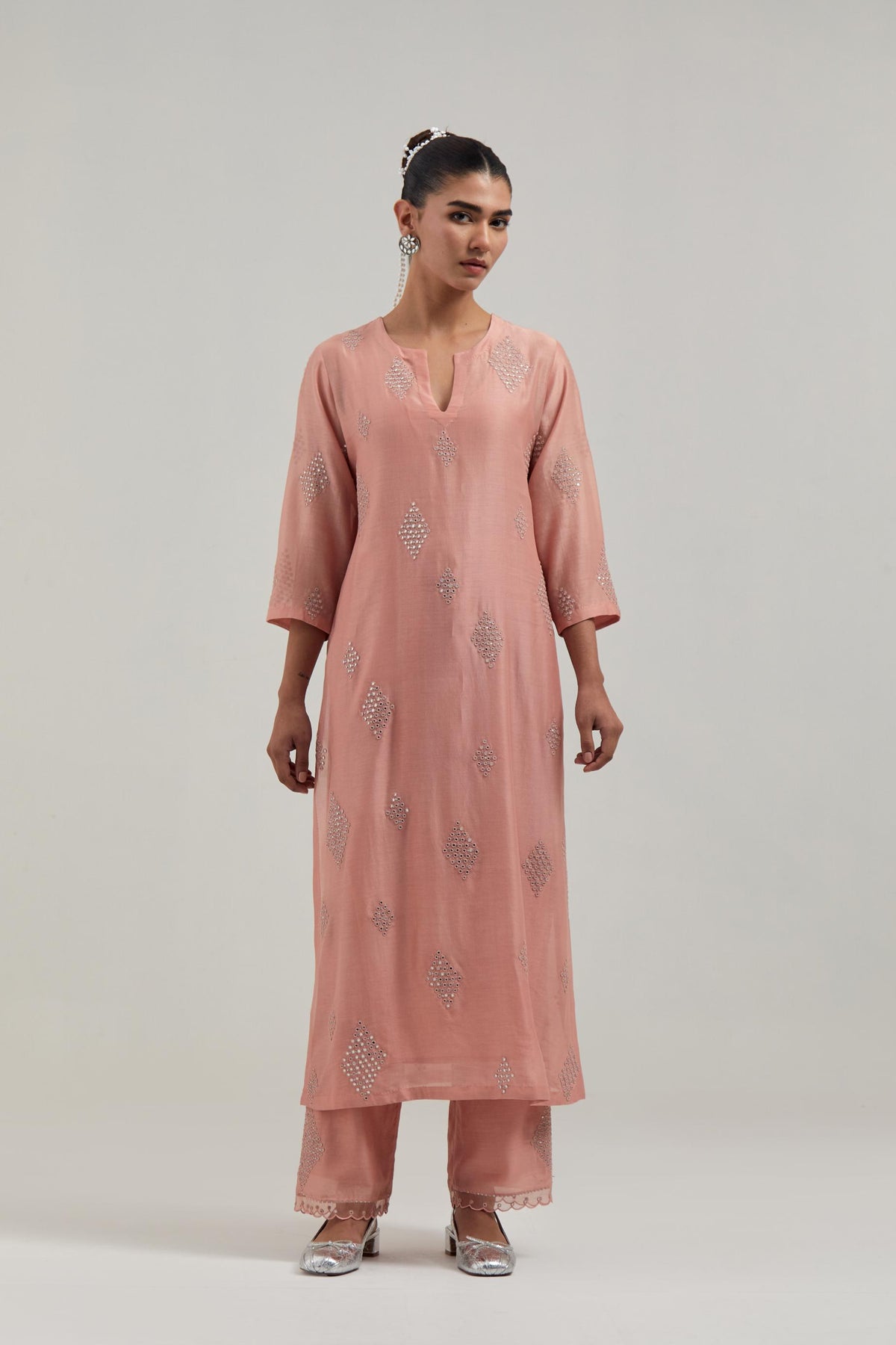 Peach Silk Chanderi straight kurta set with hand embroidered diamond motifs with delicate mirror and sequins work all-over the kurta.