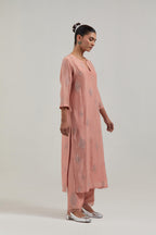 Peach Silk Chanderi straight kurta set with hand embroidered diamond motifs with delicate mirror and sequins work all-over the kurta.