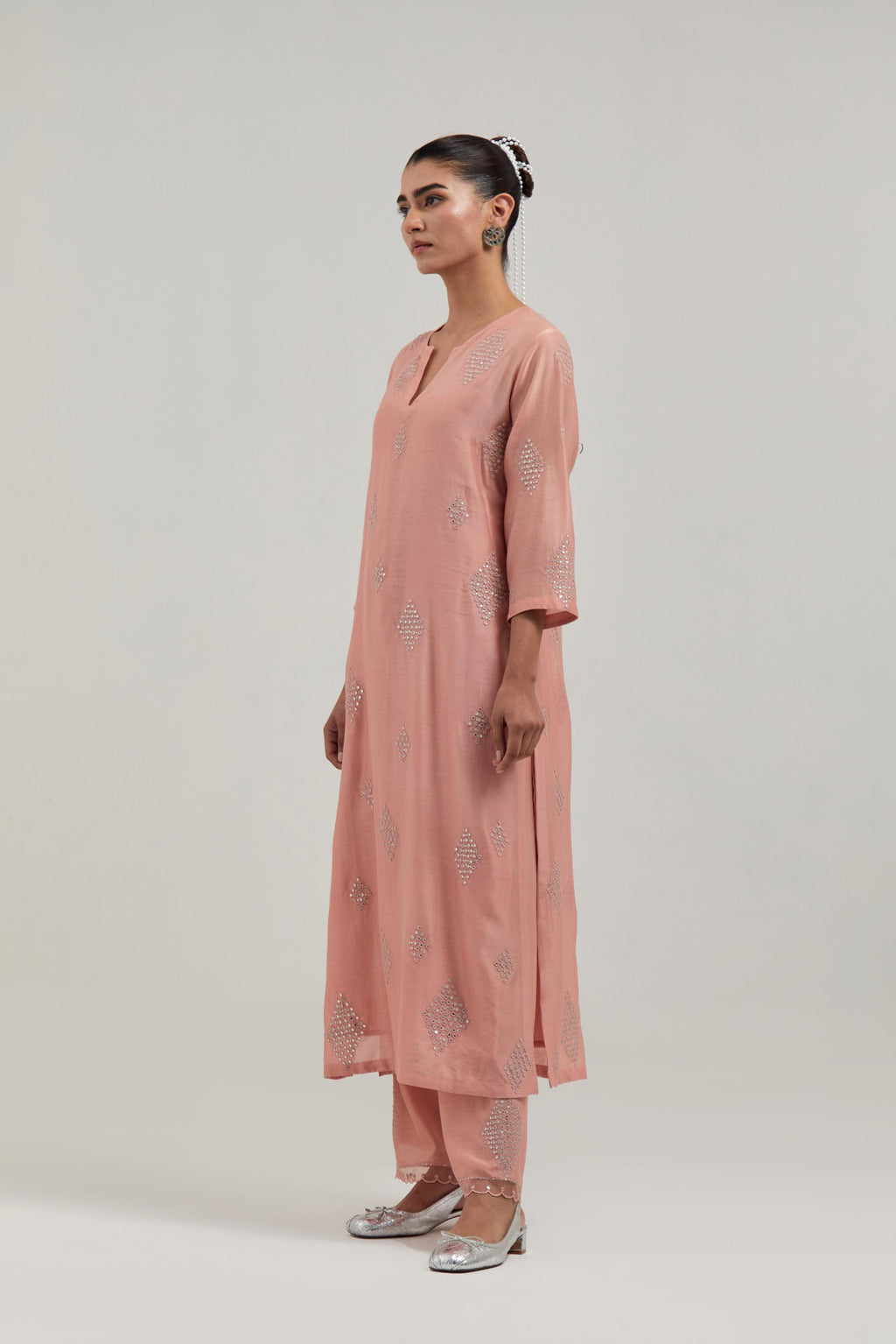 Peach Silk Chanderi straight kurta set with hand embroidered diamond motifs with delicate mirror and sequins work all-over the kurta.