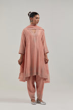 Peach silk Chanderi short kalidar kurta set, with hand embroidered mirror at neck, hem and sleeve edges, highlighted with scattered silver sequins and mirror embellishments all-over.