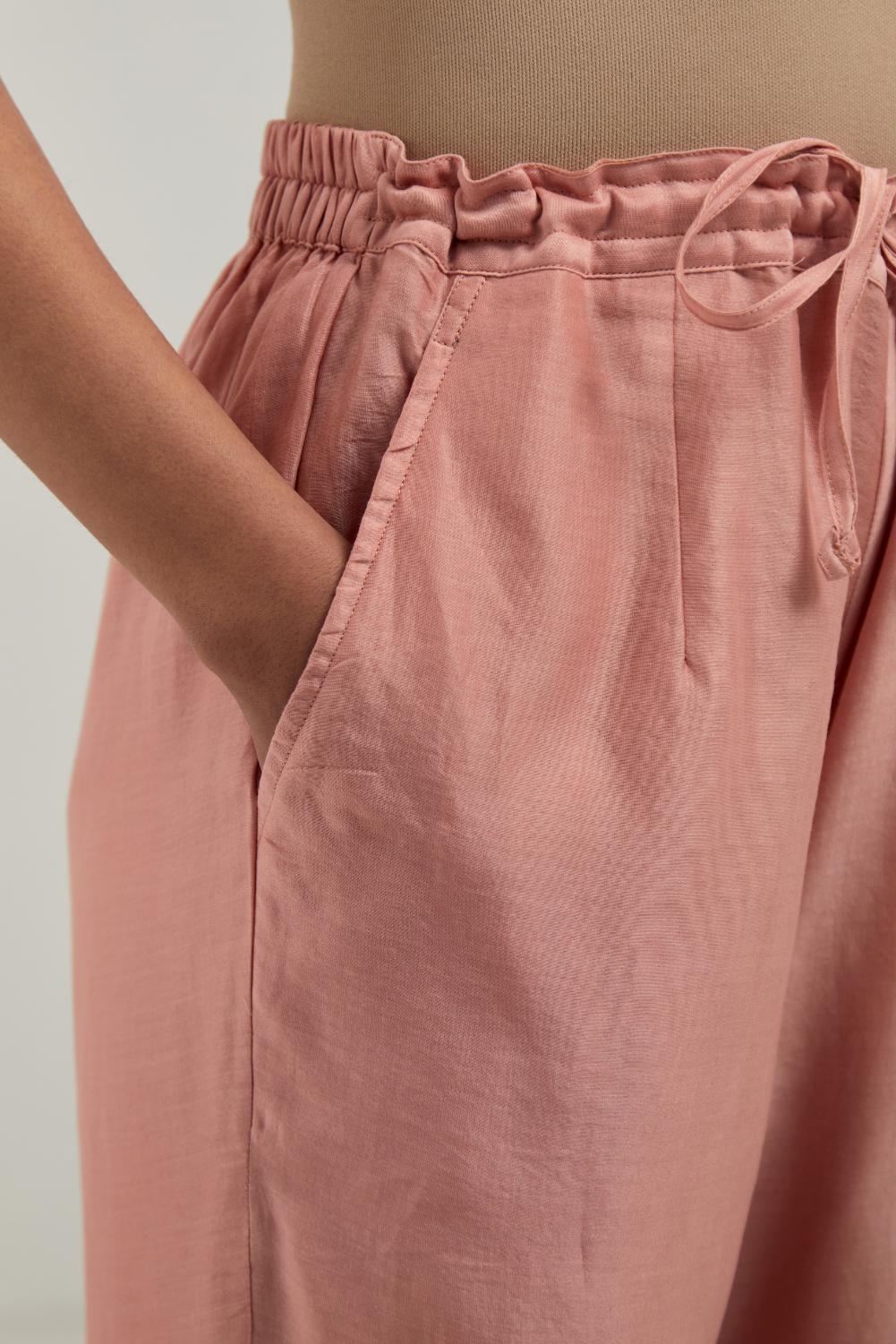 Peach silk Chanderi straight pants with narrow organza scalloped hem and hand-embroidered diamond motifs with delicate mirror & sequins work at the sides.