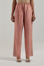 Peach Silk Chanderi pants with hand embroidered leaf motifs with delicate mirror & sequins work at hem.