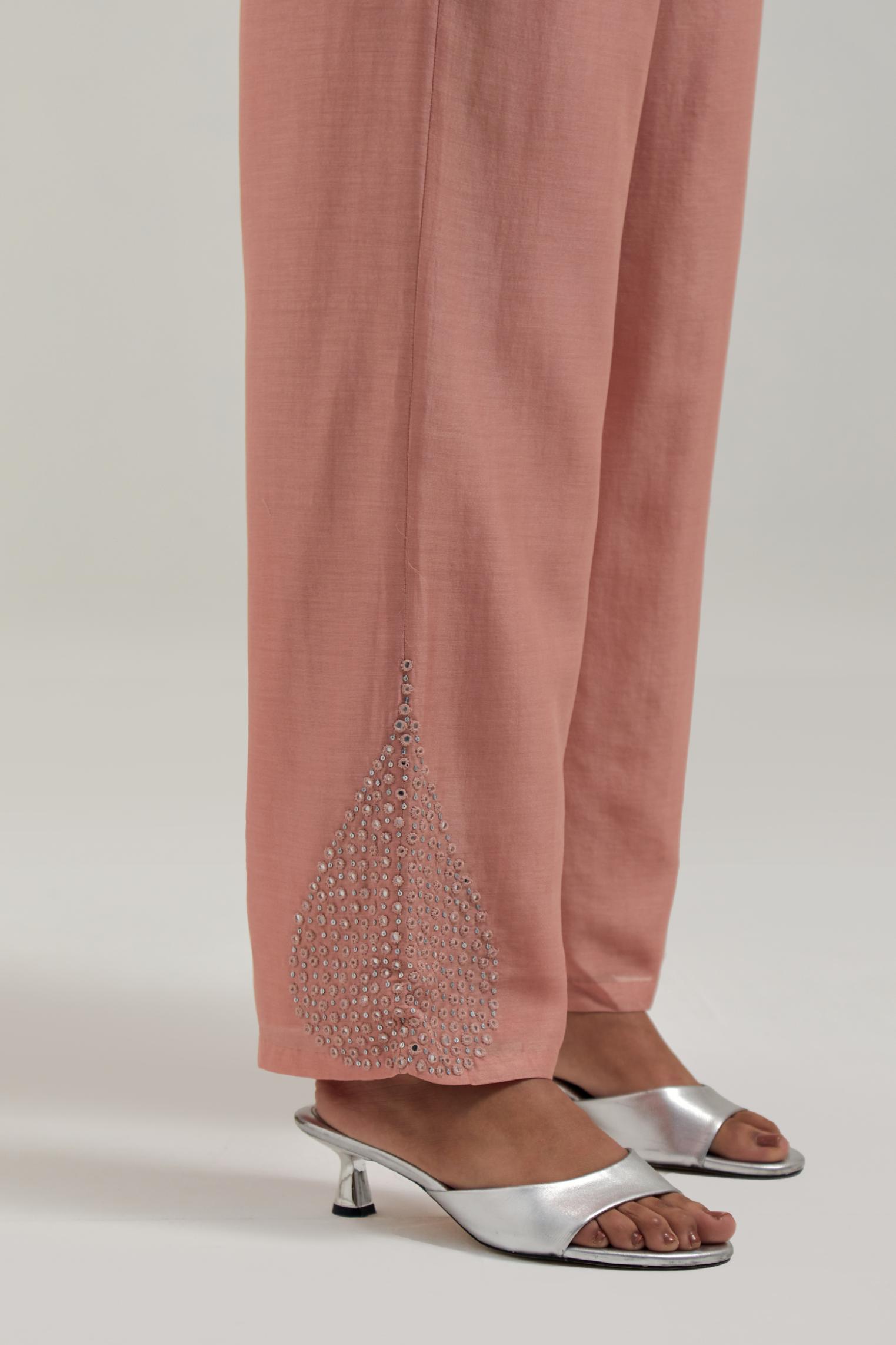 Peach Silk Chanderi pants with hand embroidered leaf motifs with delicate mirror & sequins work at hem.