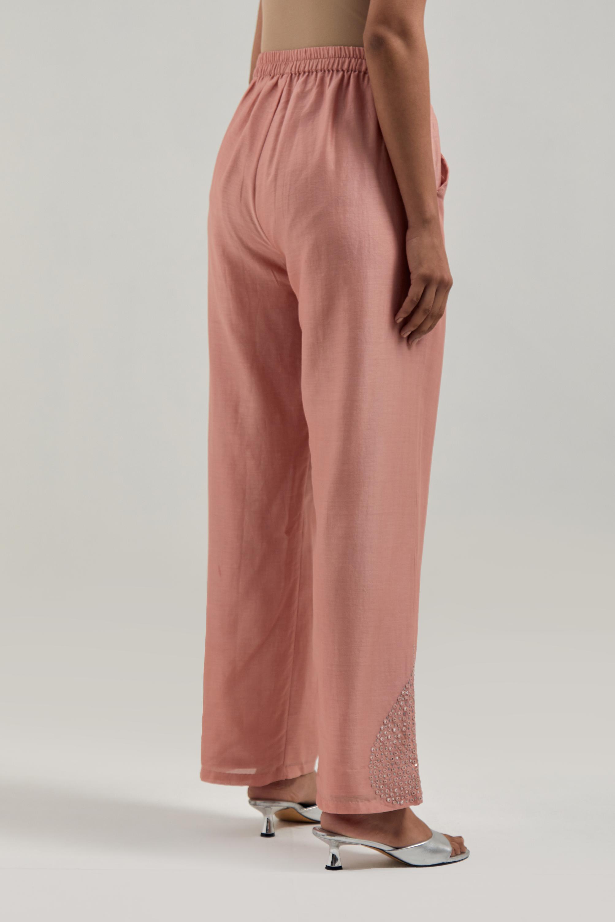 Peach Silk Chanderi pants with hand embroidered leaf motifs with delicate mirror & sequins work at hem.