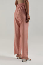 Peach silk Chanderi straight pants with narrow organza scalloped hem and hand-embroidered diamond motifs with delicate mirror & sequins work at the sides.