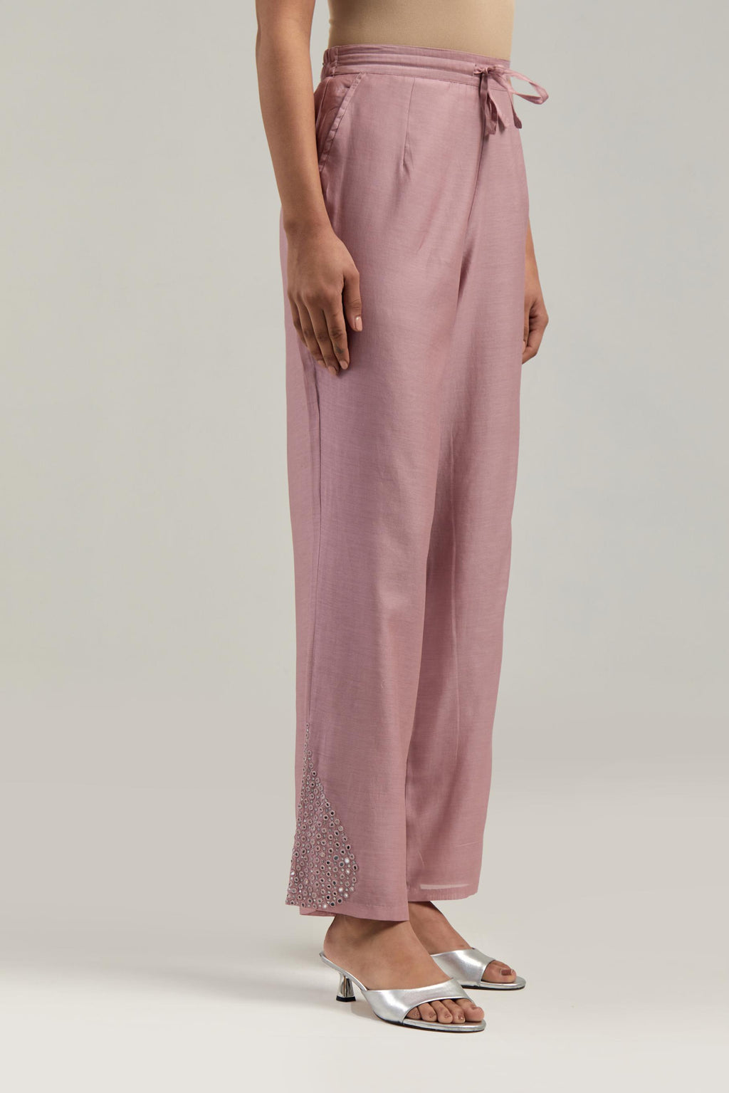 Pink Silk Chanderi pants with hand embroidered leaf motifs with delicate mirror & sequins work at hem.