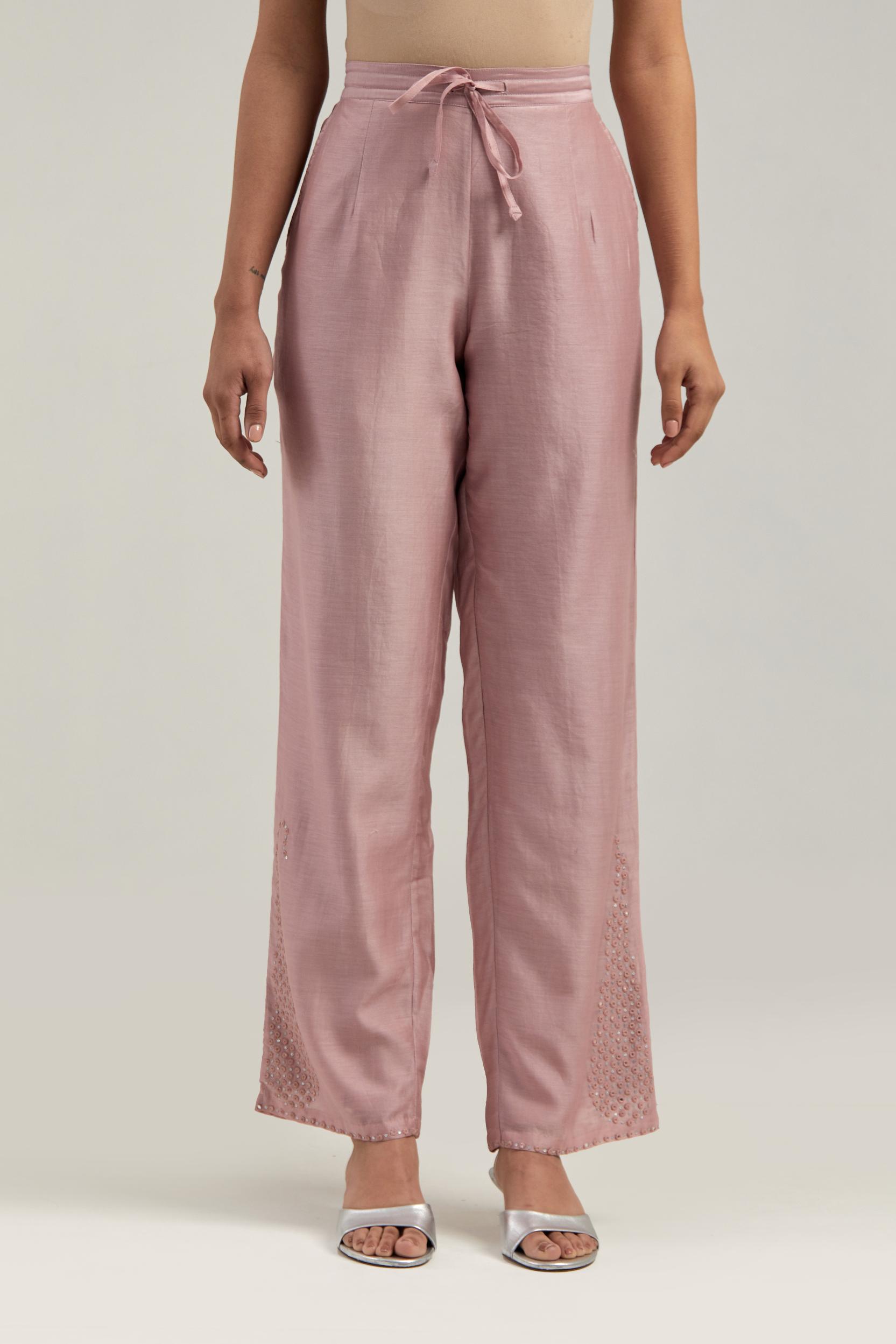 Pink silk Chanderi pants with hand-embroidered paisley motifs with delicate mirror and sequins work at the hem.