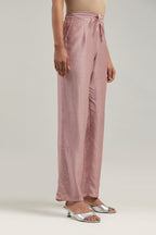 Pink silk Chanderi pants with hand-embroidered paisley motifs with delicate mirror and sequins work at the hem.