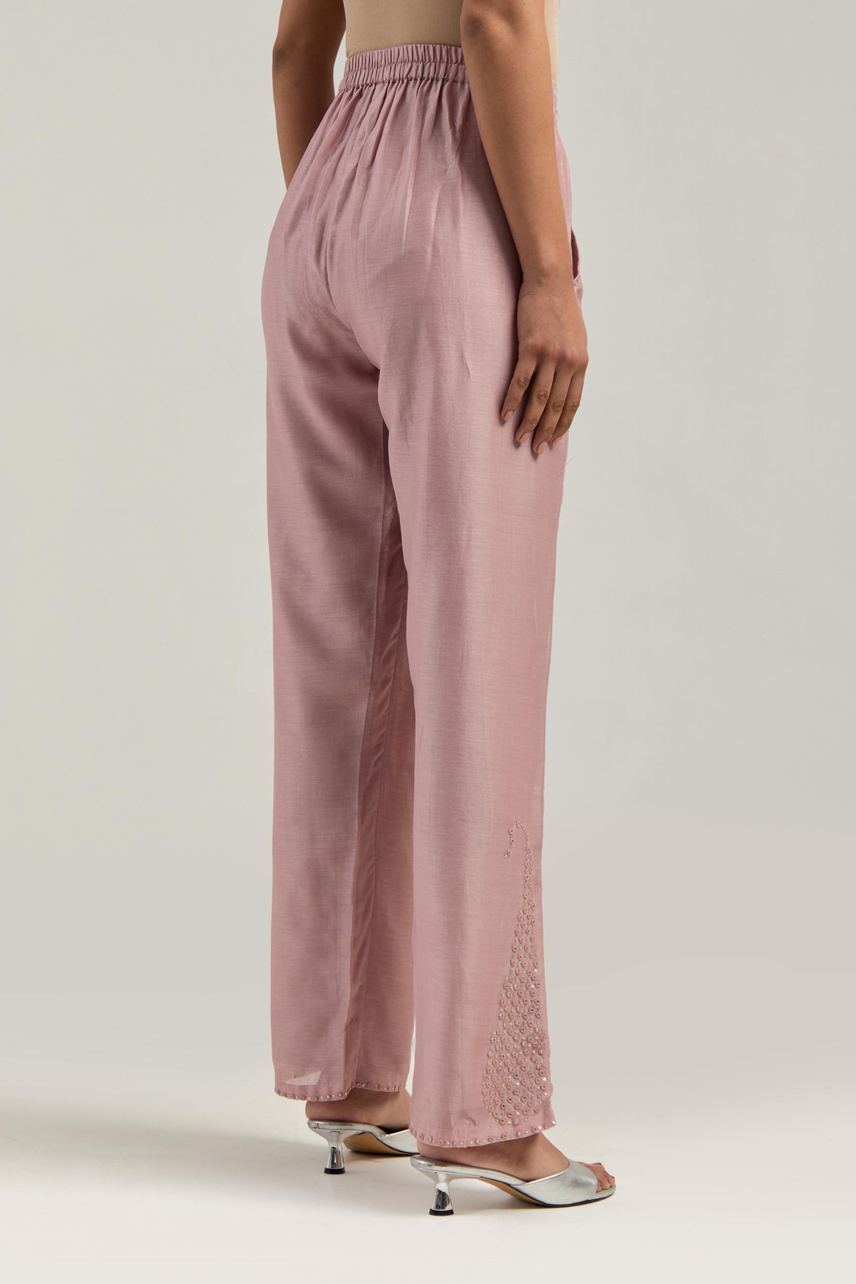 Pink silk Chanderi pants with hand-embroidered paisley motifs with delicate mirror and sequins work at the hem.