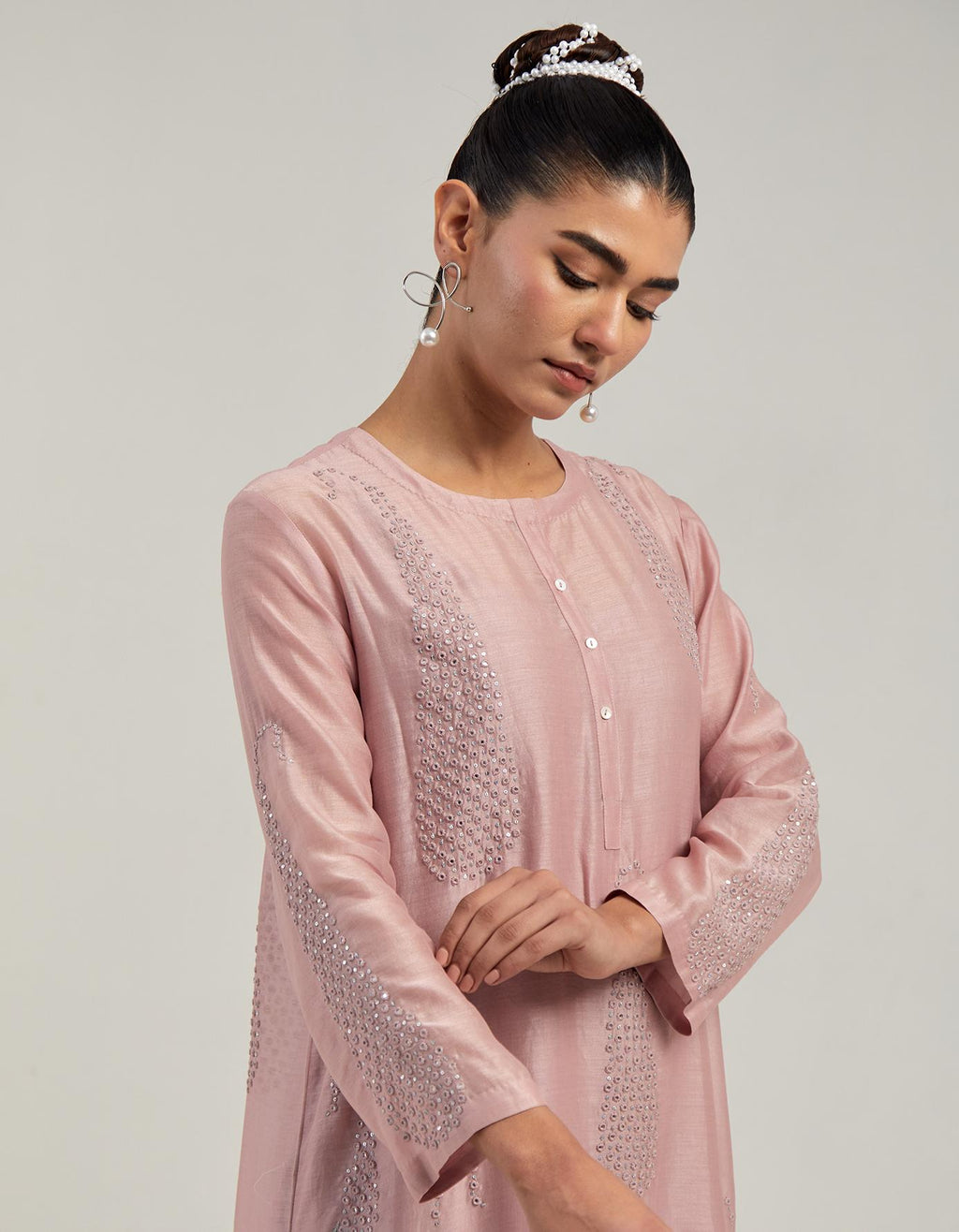 Pink Silk Chanderi short kurta set with hand-embroidered paisley motifs with delicate mirror and sequins work all-over the kurta.