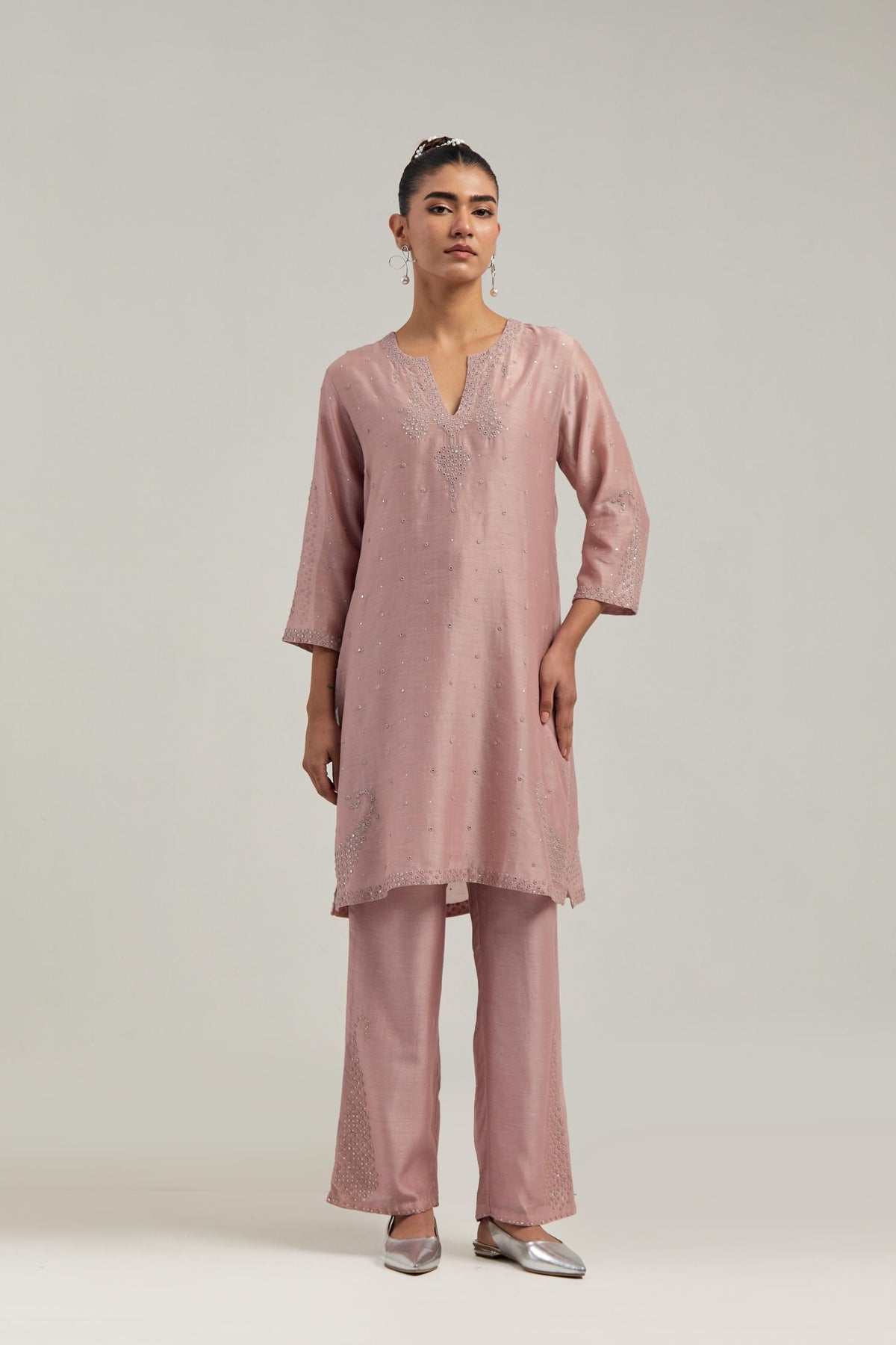 Pink silk Chanderi straight short kurta set with hand-embroidered paisley motifs with delicate mirror and sequins work at neck, hem, and sleeves, with narrow borders along the edges.