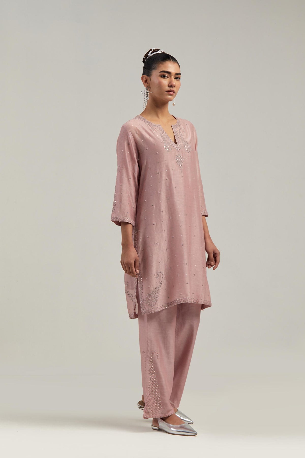 Pink silk Chanderi straight short kurta set with hand-embroidered paisley motifs with delicate mirror and sequins work at neck, hem, and sleeves, with narrow borders along the edges.