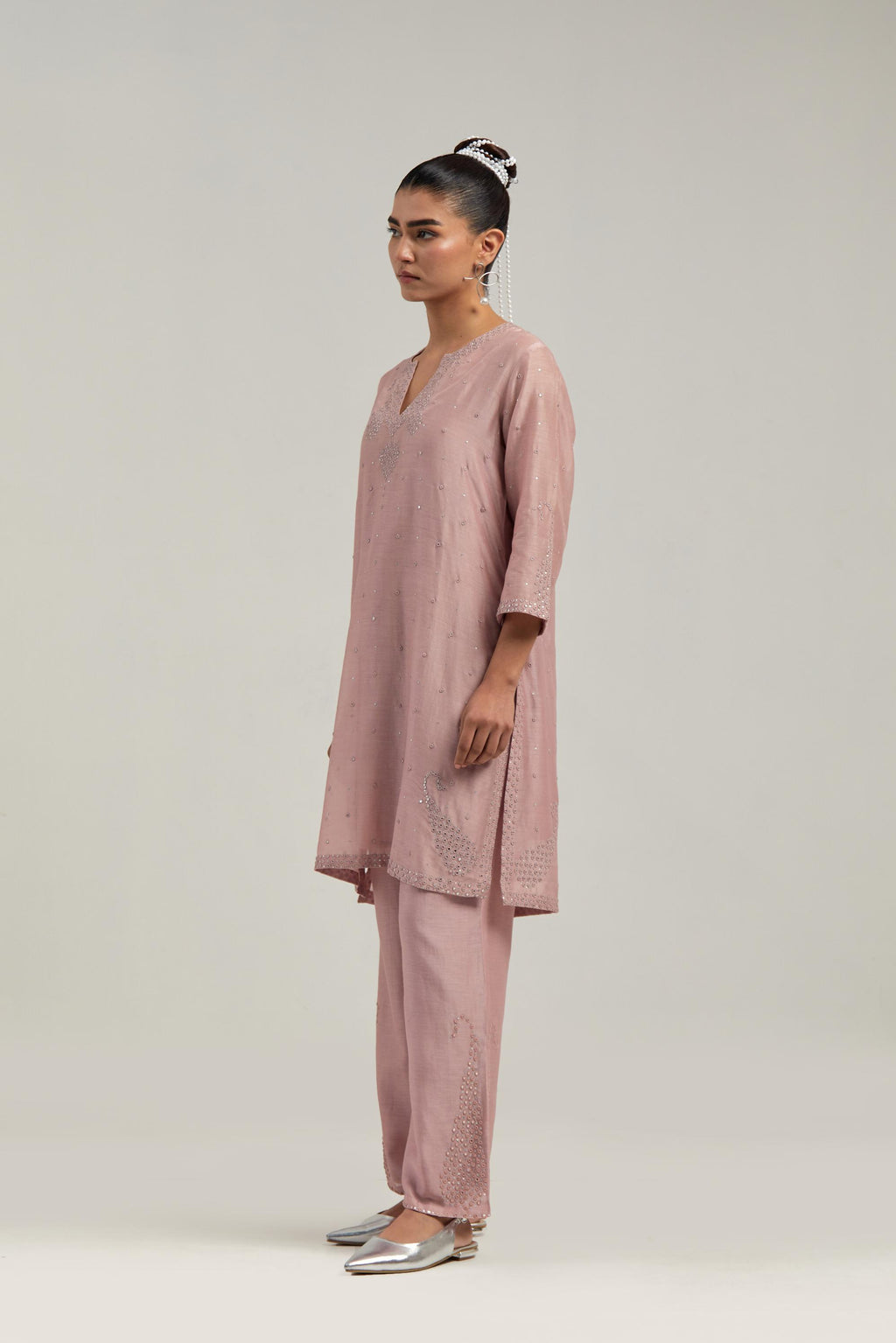 Pink silk Chanderi straight short kurta set with hand-embroidered paisley motifs with delicate mirror and sequins work at neck, hem, and sleeves, with narrow borders along the edges.