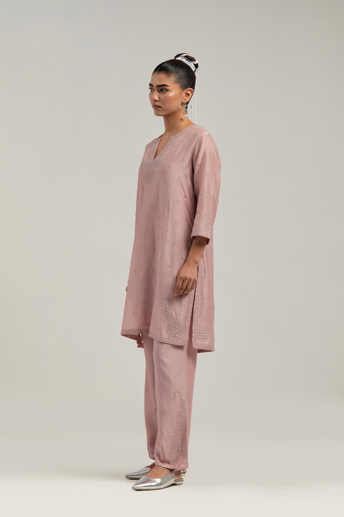 Pink silk Chanderi straight short kurta set with hand-embroidered paisley motifs with delicate mirror and sequins work at neck, hem, and sleeves, with narrow borders along the edges.