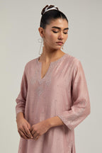 Pink silk Chanderi straight short kurta set with hand-embroidered paisley motifs with delicate mirror and sequins work at neck, hem, and sleeves, with narrow borders along the edges.