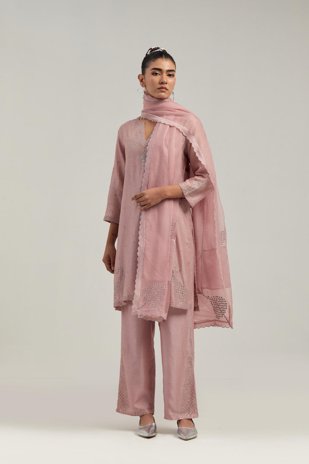 Pink silk Chanderi straight short kurta set with hand-embroidered paisley motifs with delicate mirror and sequins work at neck, hem, and sleeves, with narrow borders along the edges.