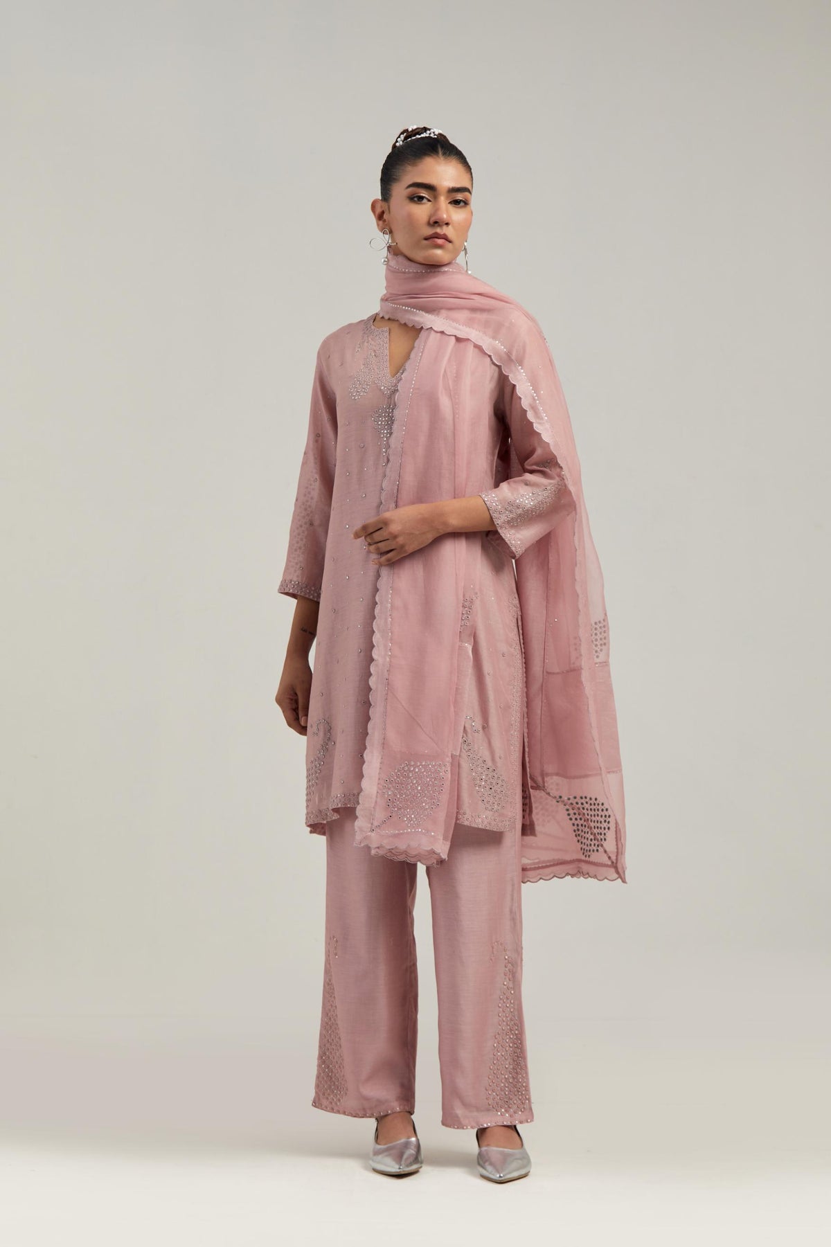 Pink silk Chanderi straight short kurta set with hand-embroidered paisley motifs with delicate mirror and sequins work at neck, hem, and sleeves, with narrow borders along the edges.